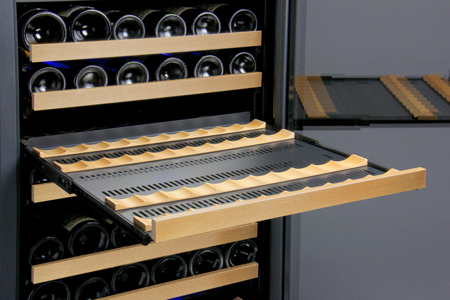 A pull-out shelf in the Allavino wine refrigerator, showing the easy access design for selecting bottles.