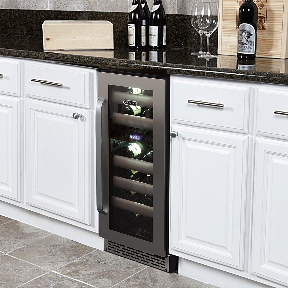 Compact dual zone wine cooler for red and white wines shown built-in with white cabinet