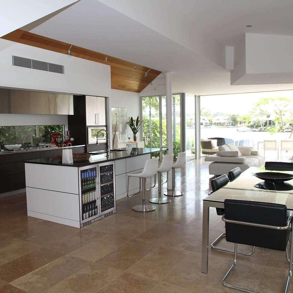 Side view of the wine and beer cooler installed in a kitchen setting, seamlessly integrated into a modern kitchen cabinet for a built-in look.