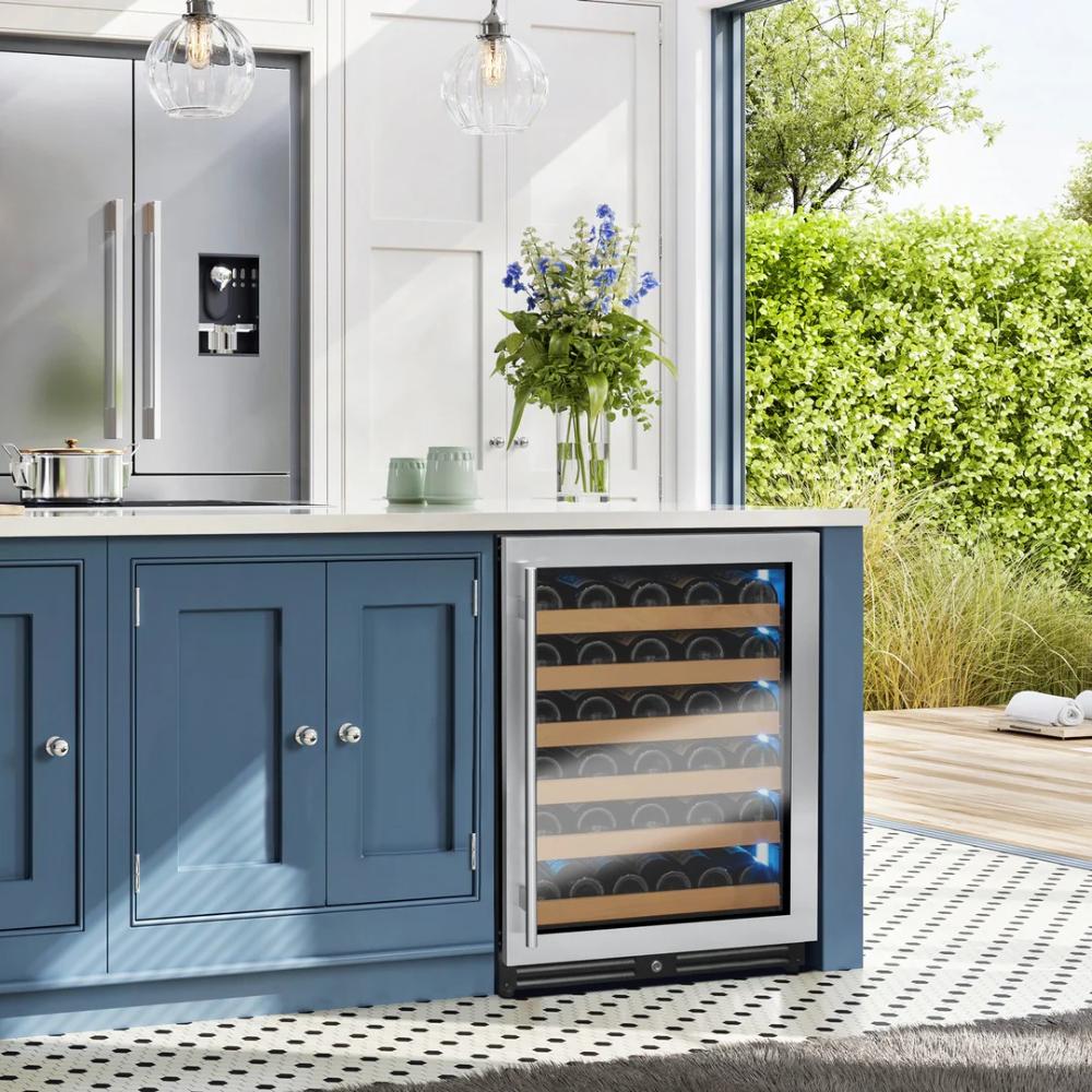 Modern kitchen with blue cabinets and a wine cooler.