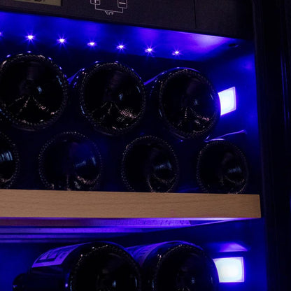 Wine bottles arranged in a wine cooler with blue lighting