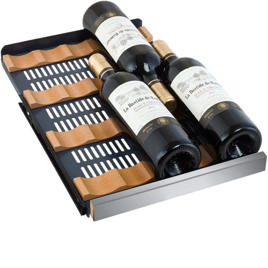 Three bottles of wine in a wooden wine rack on a white background